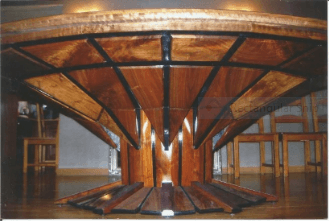 side view of John Hurdel's 5' x 8' multifaceted, oval walnut dining table,Littleton, Colorado 80123