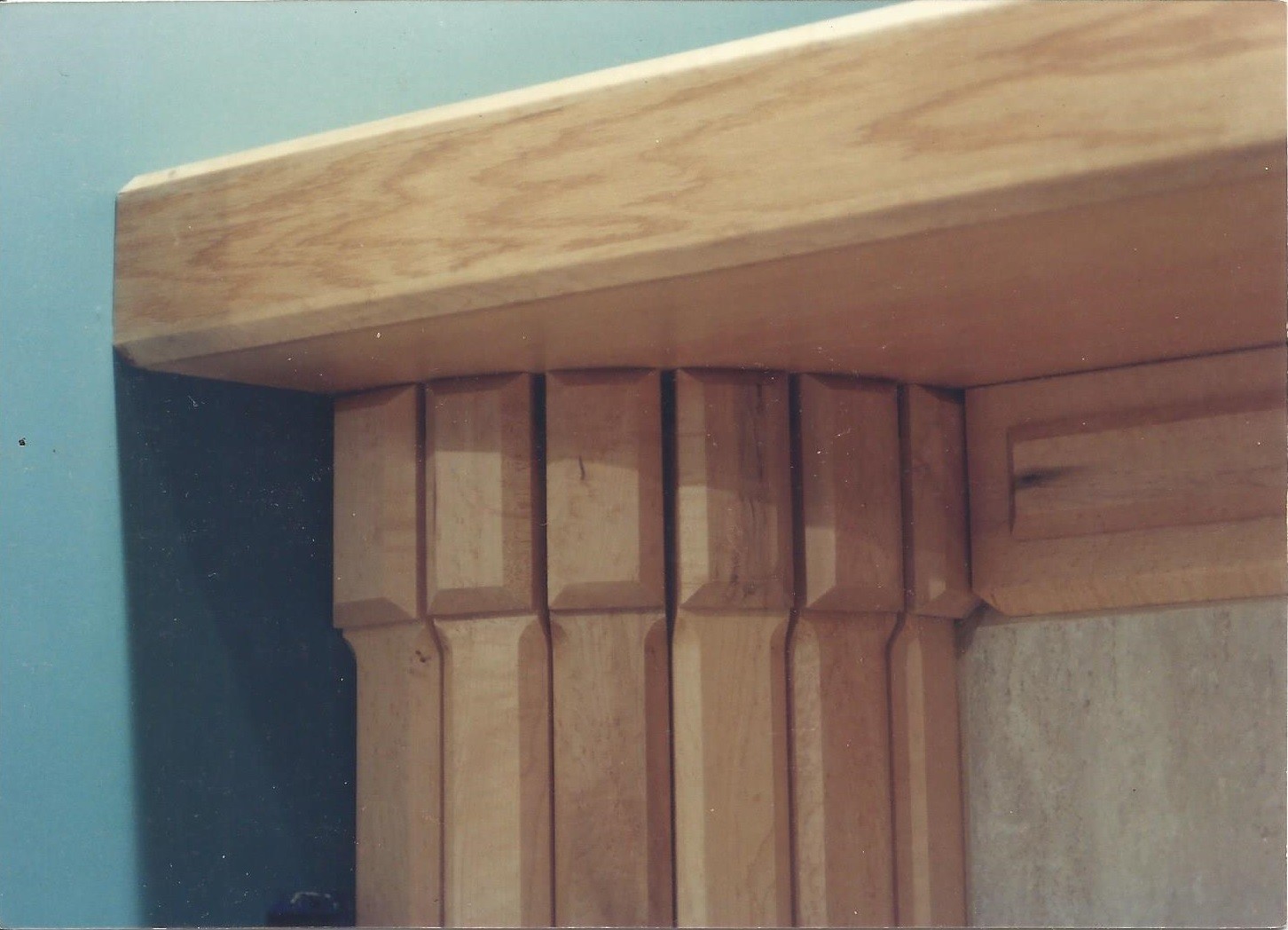 Longmont, Colorado woodworker John Hurdel shows off a detail of a maple column and mantel in West Des Moines, Iowa.